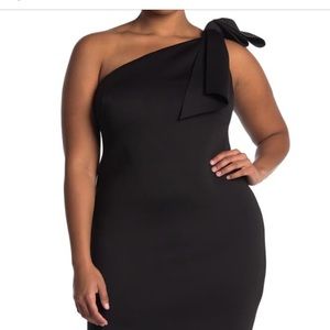 Sophisticated one shoulder black cocktail dress.
